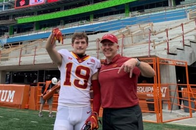 Mark Coberley and his son celebrate win over Texas